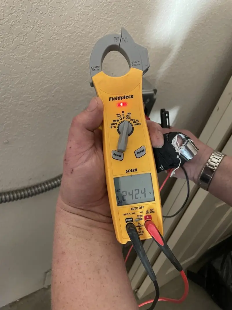 Voltage testing with clamp meter during Hot Tub / Pool Electrical Wiring in Chisholm